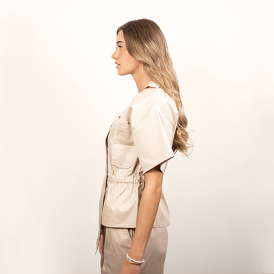 Lash tech showing the side profile of a lash tunic