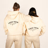 Two models wearing cream lash technician embroidered tracksuits