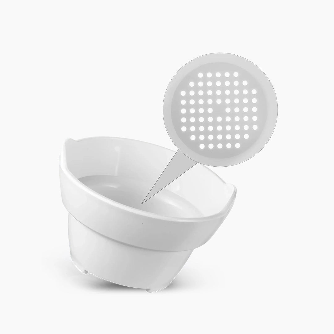 White inlei cleaning bowl with perforated base on a white background