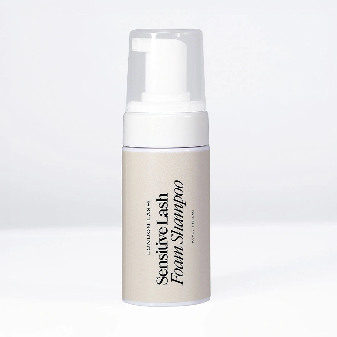 London Lash Sensitive Lash Foam Shampoo in a white foaming pump bottle with a clear cap, displayed upright on a white background.